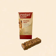 Barrette ProtiVit® GOURMET aroma noce di cocco. Rivestimento cioccolato al latte con edulcorante. Confezione da 3 barrette (da 12 gr. di proteine cadauna)